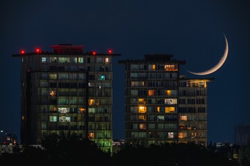 Waning Crescent Moon set over urban cityscape