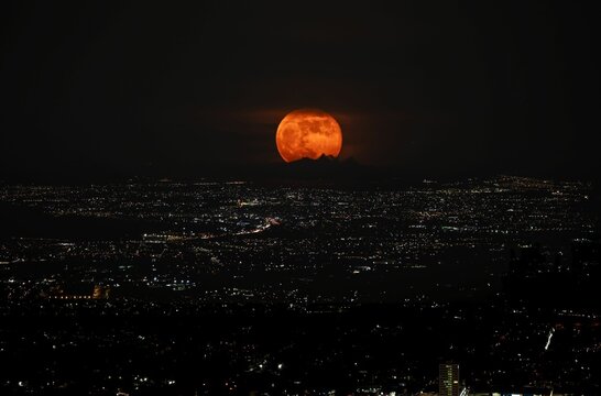 The last supermoon of 2023 rising over the city