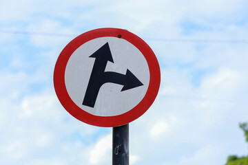 white traffic sign indicating two directions