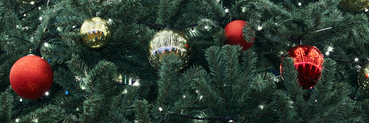 Festive New Year Christmas tree decorated red yellow Christmas balls with garlands lights, close up...