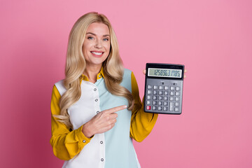Photo of gorgeous lovely woman economist wear stylish clothes hand hold calculator isolated on pink...