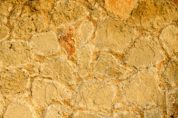 House wall made of natural stones and shell rock as background