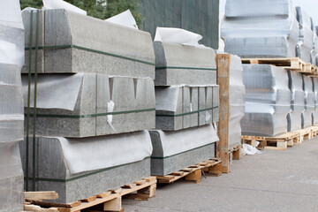 Storing road curbs in packaging on pallets. Selective focus.