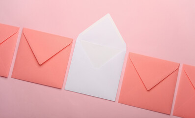 Square paper pink and white envelopes on pink background