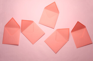 Open Square paper pink envelopes on pink background
