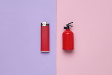 Toy extinguisher and lighter on a pastel background. Top view