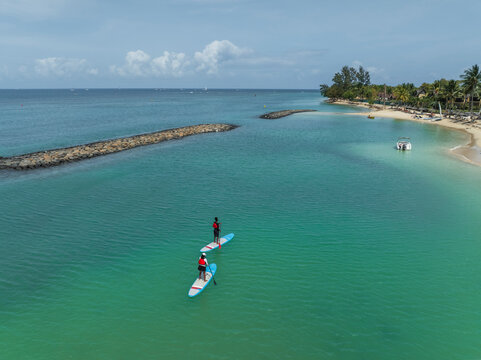 Aerial view of beautiful beach and clear blue water, Riviere Noire, Mauritius.