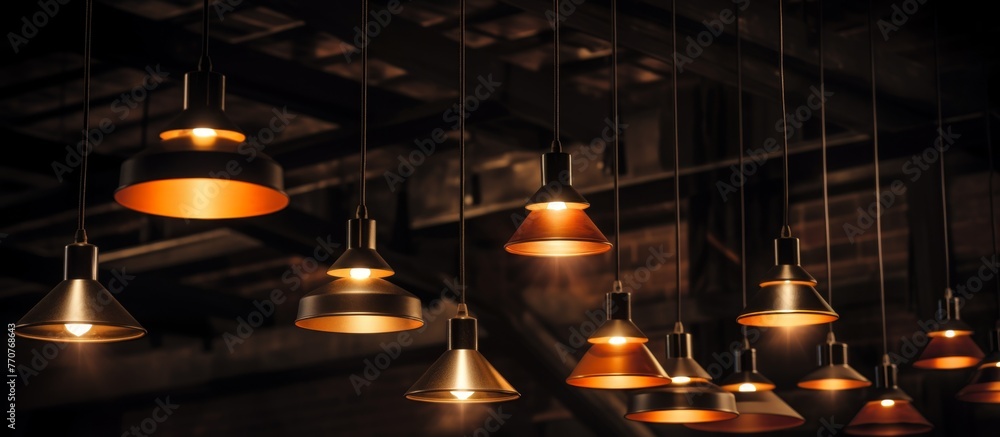 Poster a cluster of lights dangle from the ceiling of a dimly lit room, casting a warm glow in the darkness