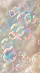 Vertical  of numerous shimmering soap bubbles floating against a soft bokeh background with pastel colors, some large with visible reflections and small ones adding depth Concept: lightness, pur