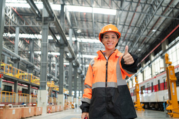 Portrait of a young female engineer standing in the skytrain repair station.