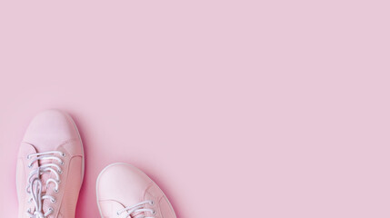 Woman fashion pink shoes on pink background with copy space.