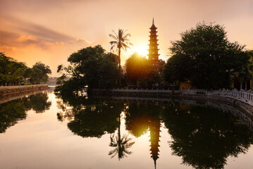 Fototapeta na wymiar Tran quoc pagoda at lake on sunset in Hanoi city, Vietnam