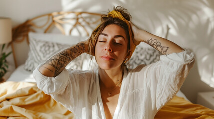 Fototapeta premium idea of oneself. Picture of a beautiful, happy woman who shuts her eyes in pleasure and embraces herself