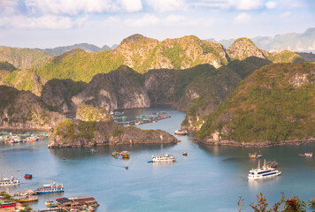 Sea landscape in Vietnam with many small islands and boats. View from above