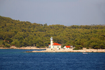 Fototapeta premium Small picturesque lighthouse on the island in the Adriatic Sea.
