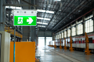Emergency exit sign on the platform of the railway repair station.