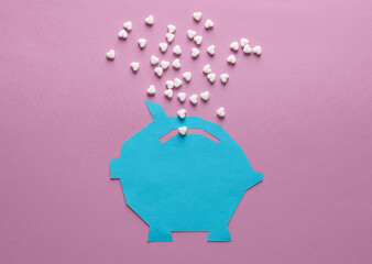 Paper-cut piggy bank with heart-shaped pills on a pink background. Medicine, love, economy concept - Powered by Adobe
