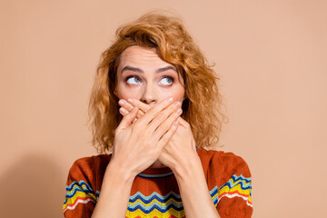 Photo of speechless woman with wavy hairdo dressed ornament t-shirt arms cover mouth look empty...