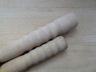 Two wooden relief parts are turned out on a woodworking machine. Figurines, furniture legs, handles...
