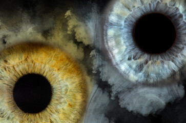 Two parts of the iris of the eye in smoke on a black background looks very cool
