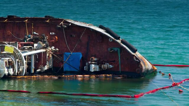 Shipwreck tanker with Crude oil releasing Toxic chemicals on offshore beach sea Water pollution