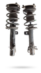 Shock absorber struts with black springs after being used on a car during replacement and repair on...