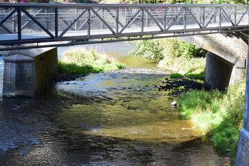 iron bridge across a small river