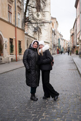 Fototapeta na wymiar Two women on the city street 