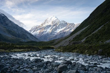 Foto op Plexiglas Aoraki/Mount Cook Alpine valley with glacial river flowing through and prominent peak in backdrop during sunset,Aoraki