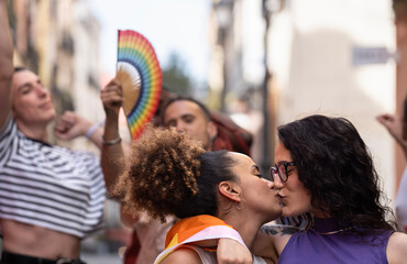 Group of LGBTQ people enjoy a pride event or parade celebration to support their community and moving towards equality