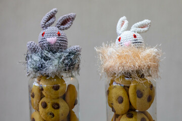 Easter scene with a bunny made using the amigurumi technique and cookies