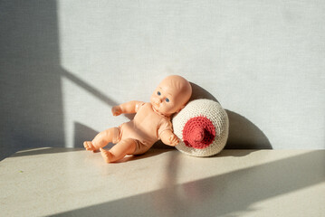 consultant on breastfeeding, lactation, female breast baby doll
