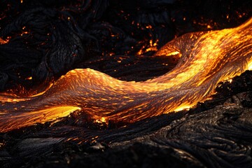 The dynamic flowing movement of a lava flow at night