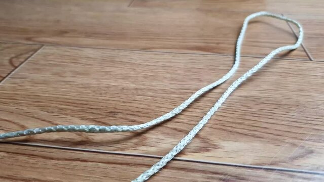 Small piece of rope, thread. Thin rope.