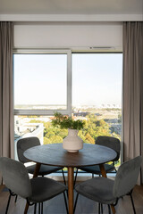 Chairs close to dining table in kitchen or living room