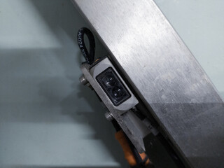 Installation of infrared sensor on the machine control. - obrazy, fototapety, plakaty