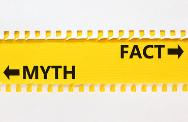 Fact or myth symbol. Concept word Myth and Fact on beautiful yellow paper. Beautiful white paper...