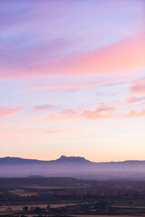 pink and orange sunset in the mountains of Sierra Cantabria full shot eye level - obrazy, fototapety, plakaty