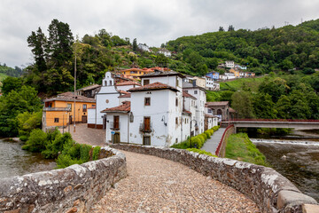 Fototapeta na wymiar Cangas de Narcea, old village view with the roman bridge and the famous chapel
