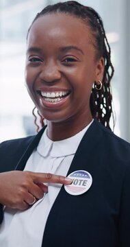 Politics, badge and face of black woman pointing for election, vote or choice. Vertical, happiness and portrait female person with button for registration, democratic party and support for change