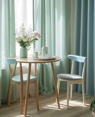A round wooden dining table with two chairs, in a light blue and white style, is placed on the left side of an apartment room
