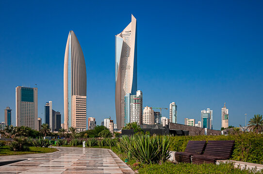 the fascinating Al Hamra Tower skyscraper in Kuwait City photographed from a beautiful urban park
