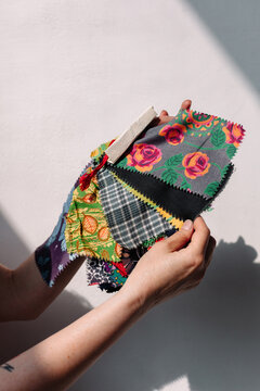 Clothing designer showing Showing Pieces Of Various Fabric
