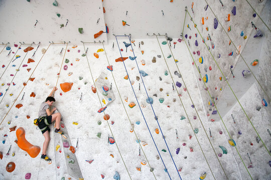 Young teenager rock climbing
