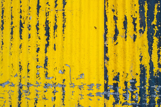 Colorful yellow painted corrugated wall