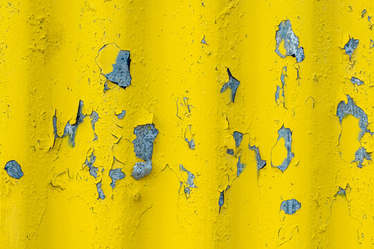 Colorful yellow painted corrugated wall