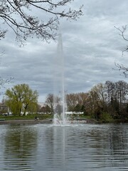 fountain on the city lake in the park
