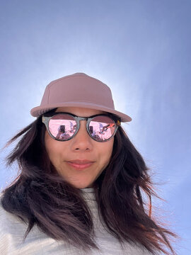 Low angle selfie woman looking at camera