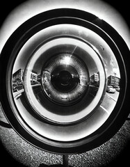 Vintage Retro Fisheye Lens Experimental Photography | This black and white image captures a unique perspective through the use of a fisheye lens, creating a distorted, experimental view of a city - obrazy, fototapety, plakaty
