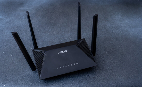ASUS Router for connecting and distributing Wi-Fi Internet. Black background. Ukraine, Kyiv - March 25, 2024